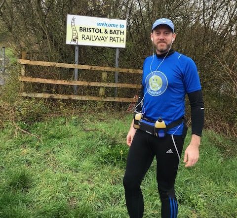 Daniel Curl standing infront of the bristol to bath railway path sign