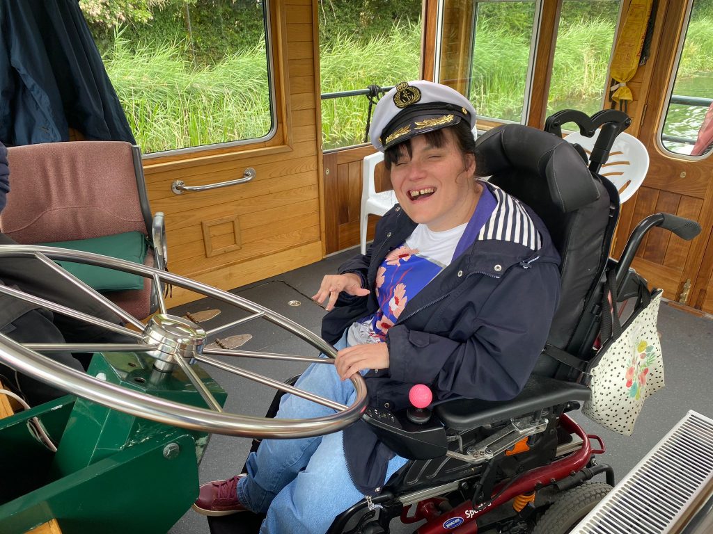 Lisa manners stirring the boat on the Willow Trust Canal boat trip